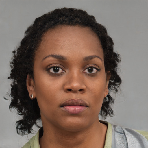 Neutral black young-adult female with short  brown hair and brown eyes