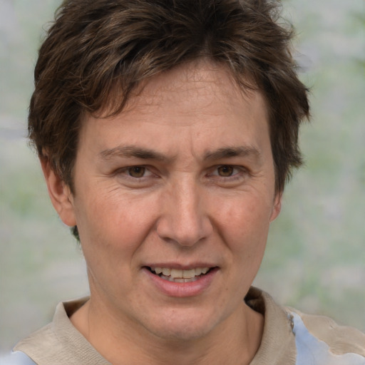 Joyful white adult female with short  brown hair and brown eyes