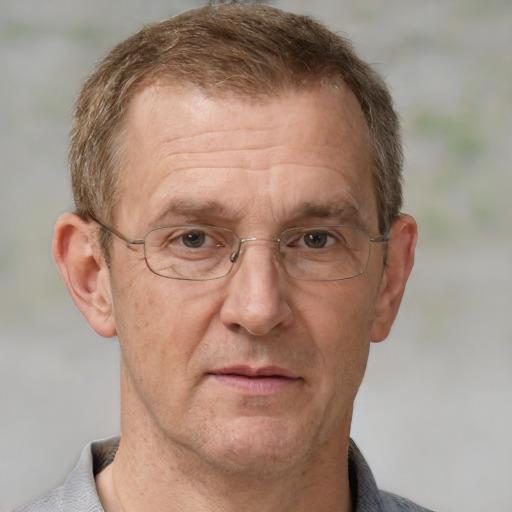 Joyful white middle-aged male with short  brown hair and grey eyes