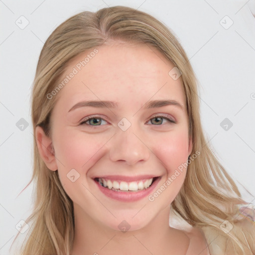 Joyful white young-adult female with long  brown hair and blue eyes