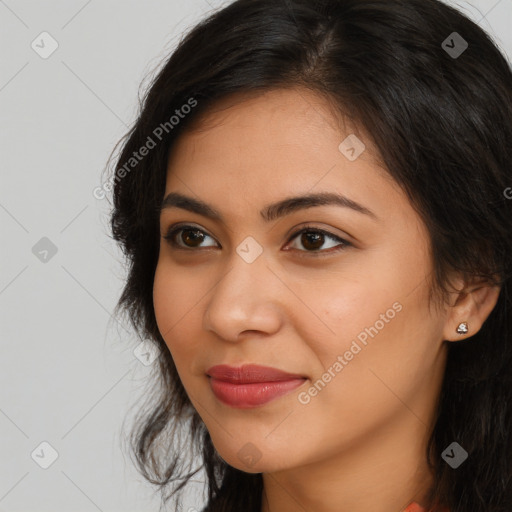 Joyful latino young-adult female with long  brown hair and brown eyes