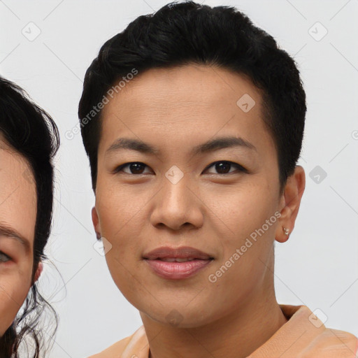 Joyful asian young-adult female with short  black hair and brown eyes