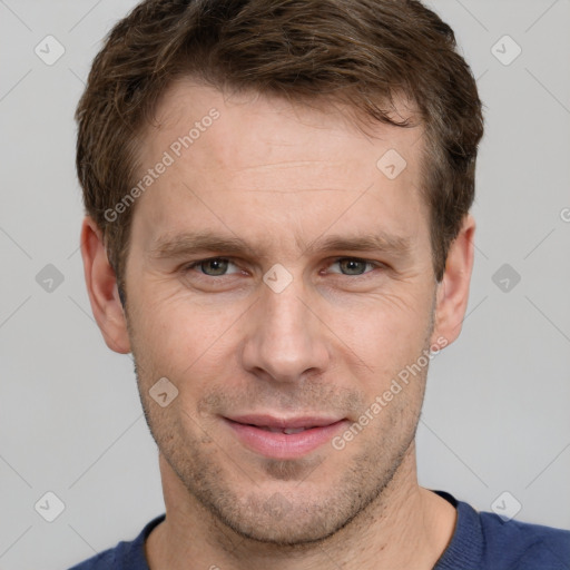 Joyful white adult male with short  brown hair and grey eyes