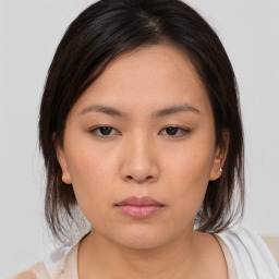 Neutral asian young-adult female with medium  brown hair and brown eyes