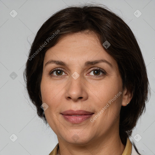 Joyful white adult female with medium  brown hair and grey eyes