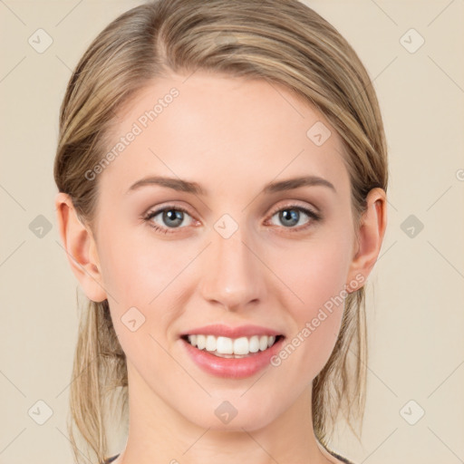 Joyful white young-adult female with long  brown hair and blue eyes