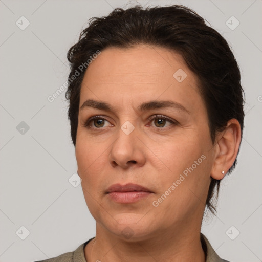 Joyful white adult female with short  brown hair and brown eyes