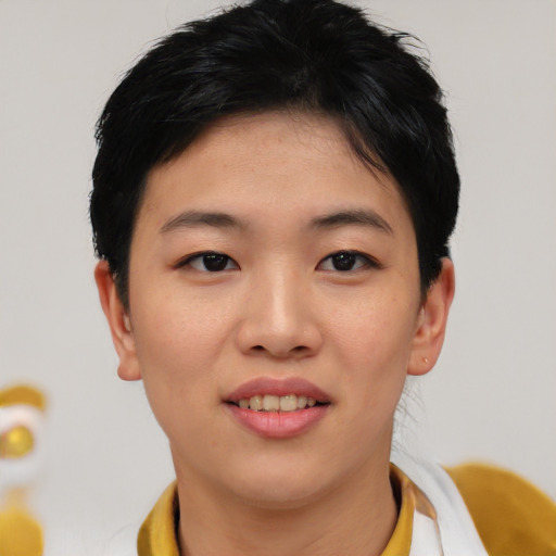 Joyful asian young-adult female with short  black hair and brown eyes