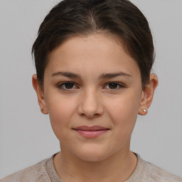 Joyful white child female with short  brown hair and brown eyes