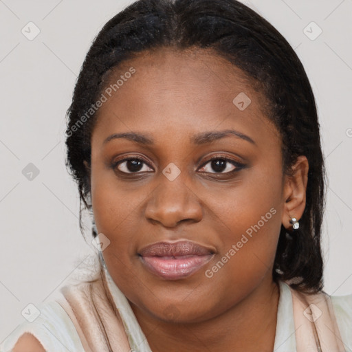 Joyful black young-adult female with long  black hair and brown eyes