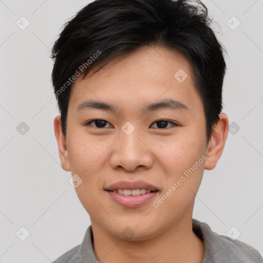 Joyful asian young-adult male with short  black hair and brown eyes