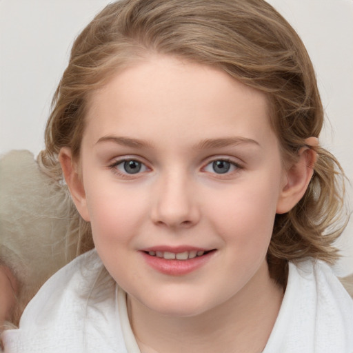 Joyful white child female with medium  brown hair and blue eyes