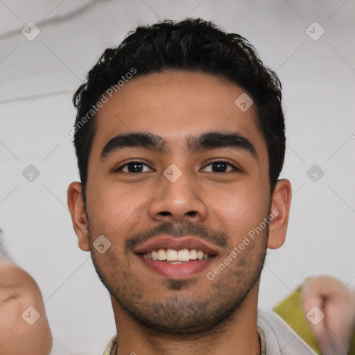 Joyful latino young-adult male with short  black hair and brown eyes