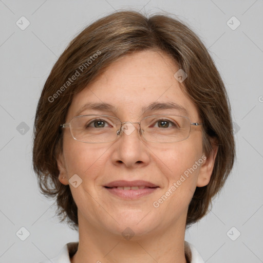 Joyful white adult female with medium  brown hair and green eyes