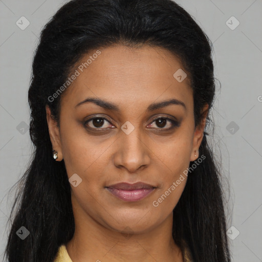 Joyful black young-adult female with long  brown hair and brown eyes