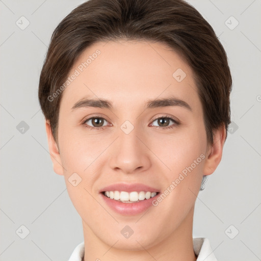 Joyful white young-adult female with short  brown hair and brown eyes