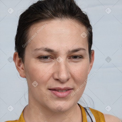 Joyful white adult female with short  brown hair and brown eyes