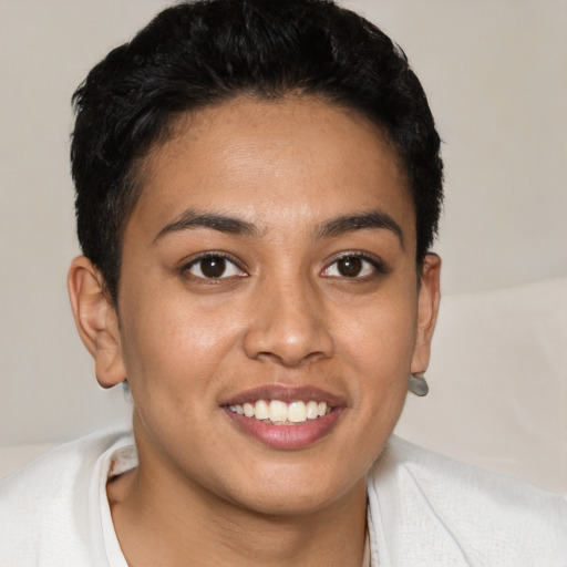 Joyful latino young-adult female with short  brown hair and brown eyes