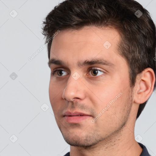 Neutral white young-adult male with short  brown hair and brown eyes