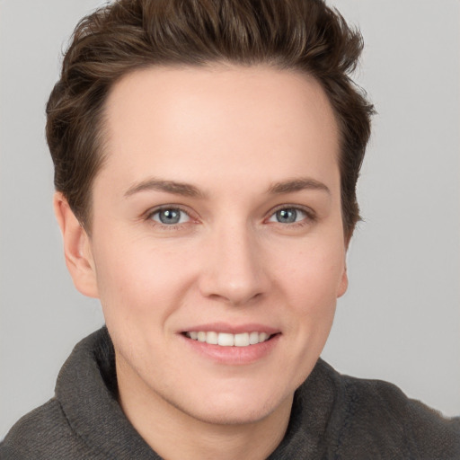 Joyful white young-adult female with short  brown hair and grey eyes