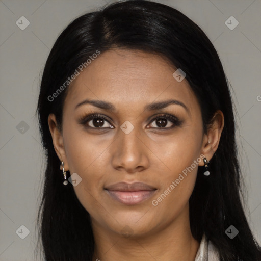 Joyful black young-adult female with long  black hair and brown eyes