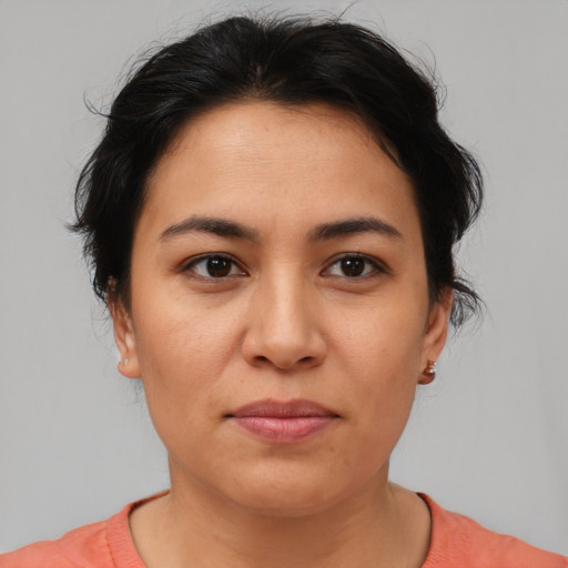 Joyful asian young-adult female with short  brown hair and brown eyes