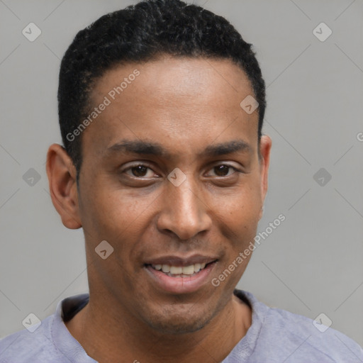 Joyful latino young-adult male with short  black hair and brown eyes