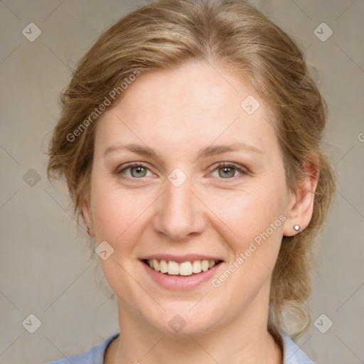 Joyful white young-adult female with medium  brown hair and blue eyes