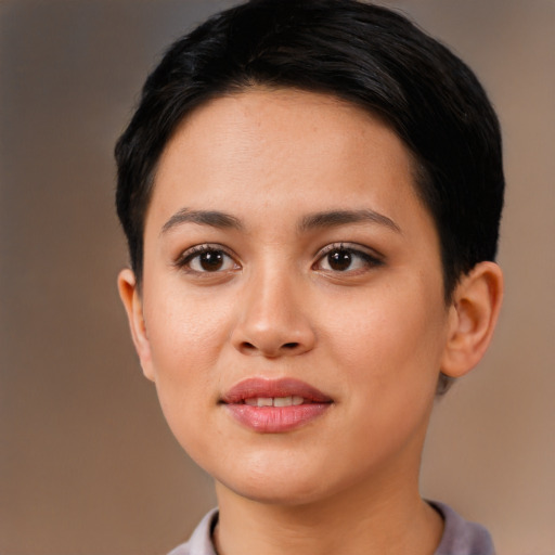 Joyful latino young-adult female with short  black hair and brown eyes