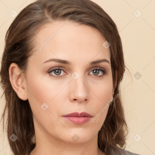 Neutral white young-adult female with long  brown hair and brown eyes