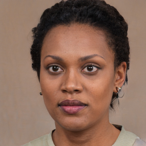 Neutral black young-adult female with short  black hair and brown eyes