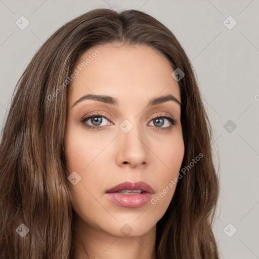 Neutral white young-adult female with long  brown hair and brown eyes