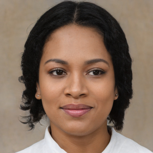 Joyful latino young-adult female with medium  black hair and brown eyes