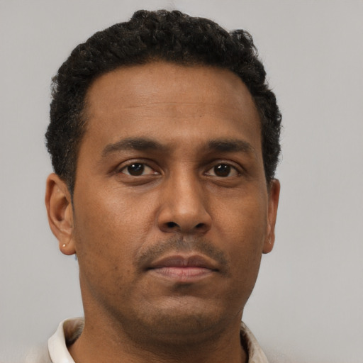 Neutral black young-adult male with short  brown hair and brown eyes
