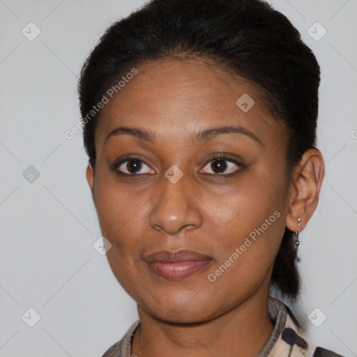 Joyful black young-adult female with short  brown hair and brown eyes