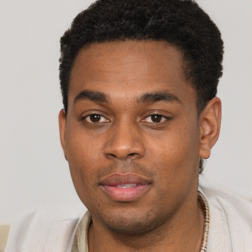 Neutral black young-adult male with short  black hair and brown eyes