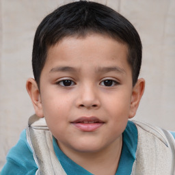 Joyful white child male with short  brown hair and brown eyes