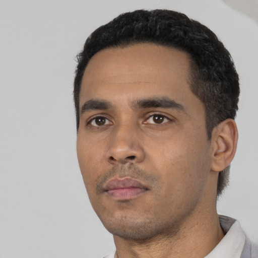 Neutral black young-adult male with short  black hair and brown eyes
