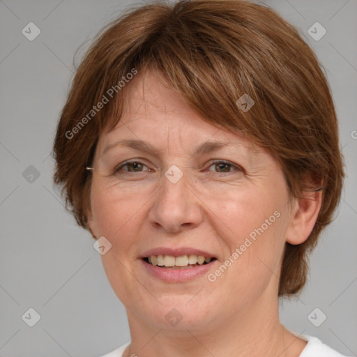 Joyful white adult female with medium  brown hair and grey eyes