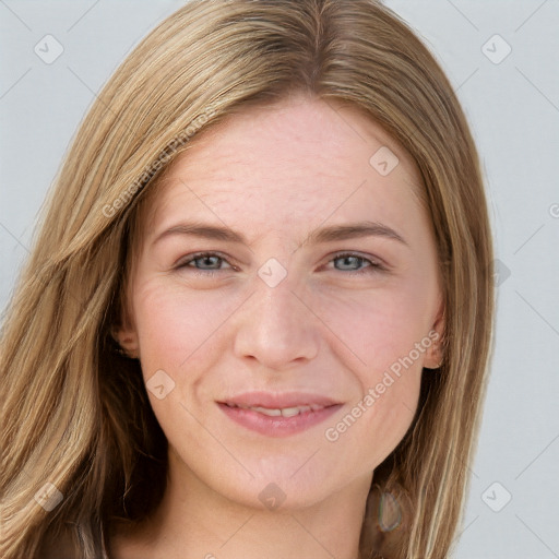 Joyful white young-adult female with long  brown hair and green eyes