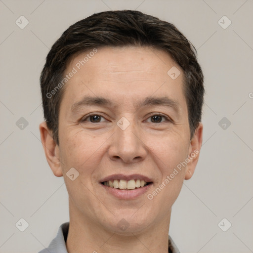 Joyful white adult male with short  brown hair and brown eyes