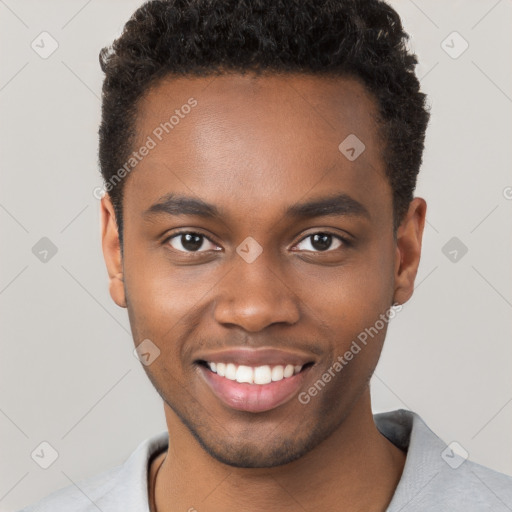 Joyful black young-adult male with short  brown hair and brown eyes