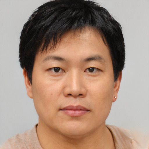 Neutral asian young-adult male with short  brown hair and brown eyes