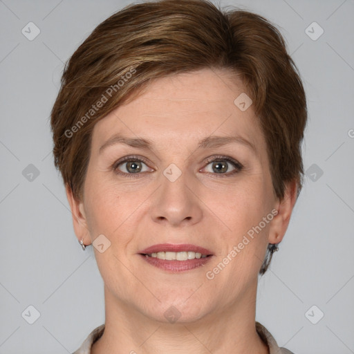 Joyful white adult female with short  brown hair and grey eyes