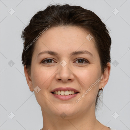 Joyful white young-adult female with short  brown hair and brown eyes