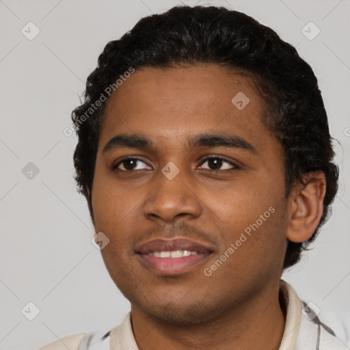 Joyful black young-adult male with short  black hair and brown eyes