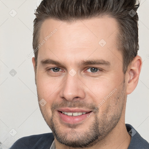 Joyful white young-adult male with short  brown hair and brown eyes