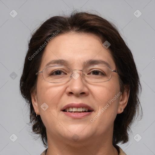 Joyful white adult female with medium  brown hair and brown eyes