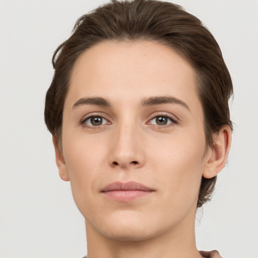 Neutral white young-adult female with short  brown hair and brown eyes