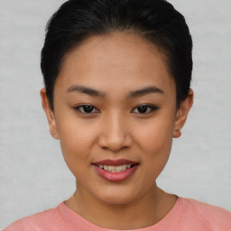 Joyful asian young-adult female with short  brown hair and brown eyes